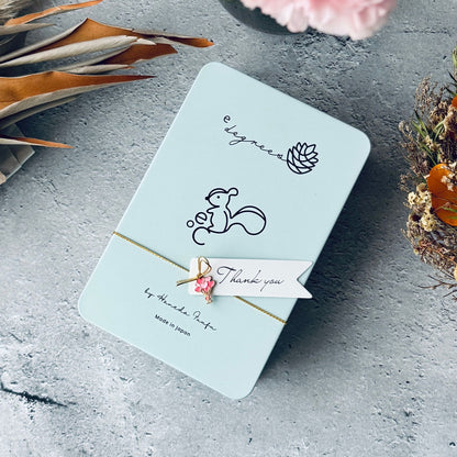 Thank youタグ付きクッキー缶 | お取り寄せギフトに最適なかわいいお紐のアレンジ